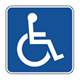 The international sign for disabilities, an outline of a person in a wheelchair.